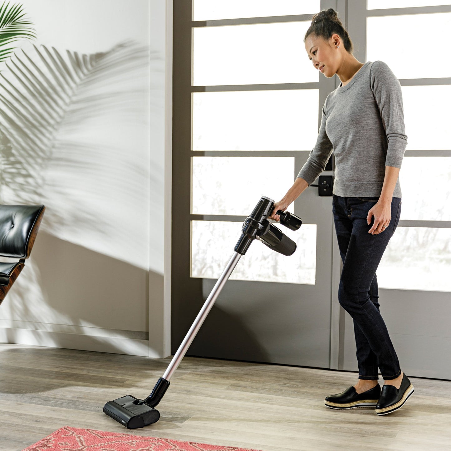 Black cordless vacuum with pod bagged technology